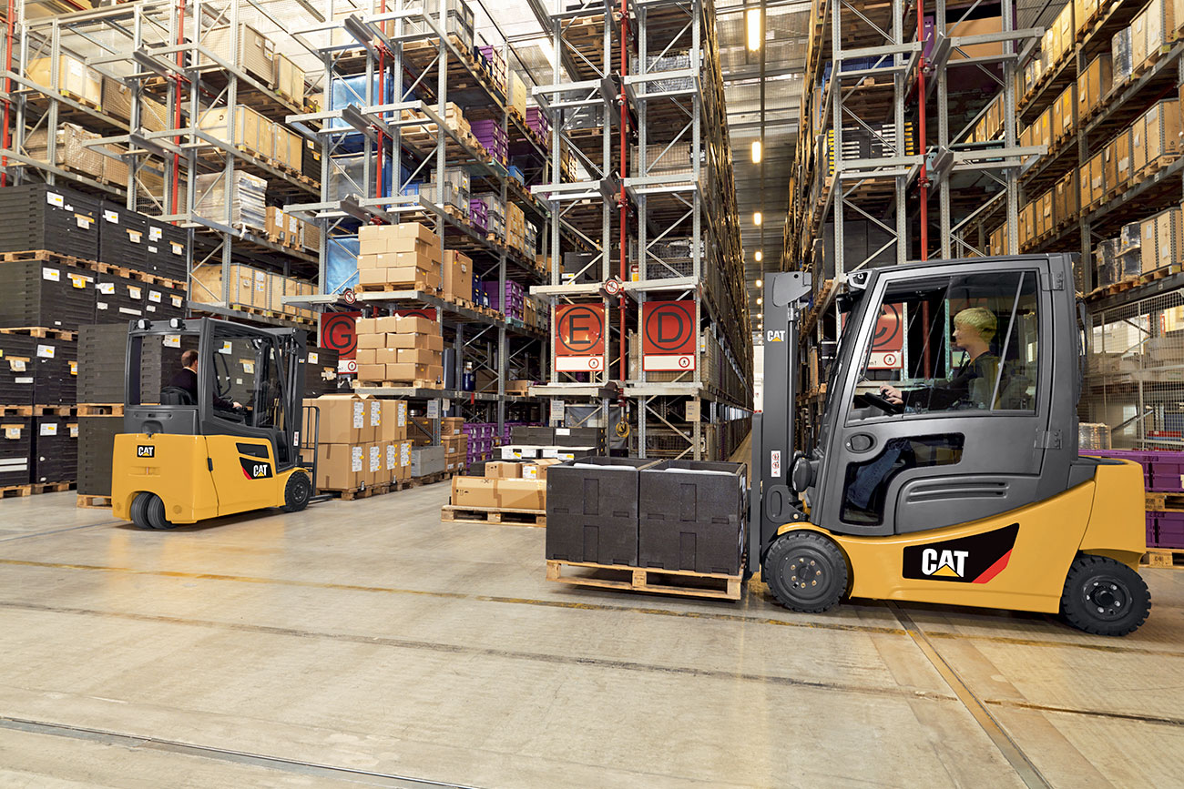 Two Cat Forklifts in a Warehouse