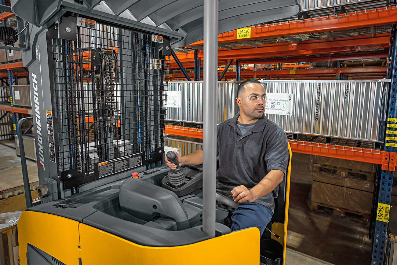 Forklift Operator in Warehouse Aisle on a Narrow Aisle Forklift