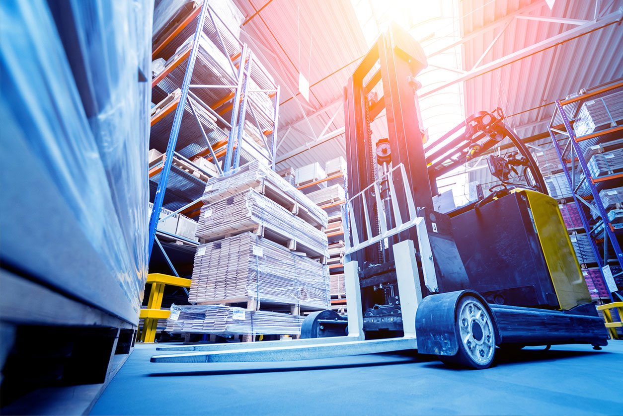 two forklifts in warehouse