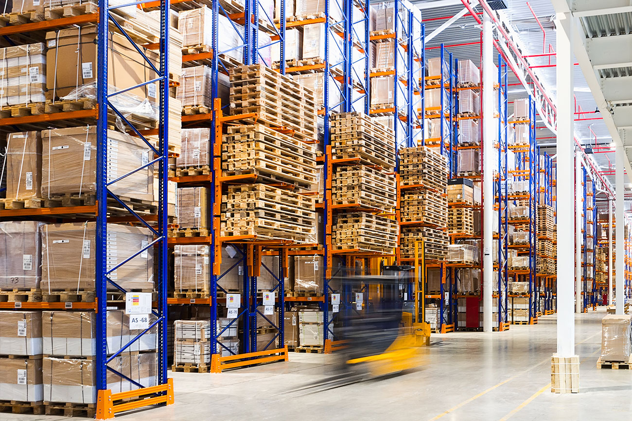 Forklift moving quickly through warehouse rack