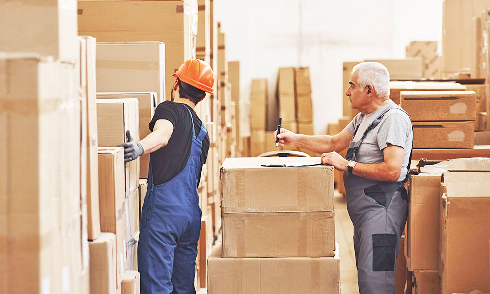 Men in distribution warehouse