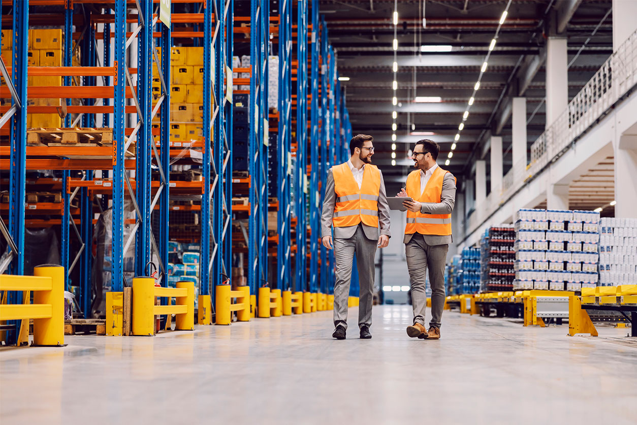 Two men in a warehouse