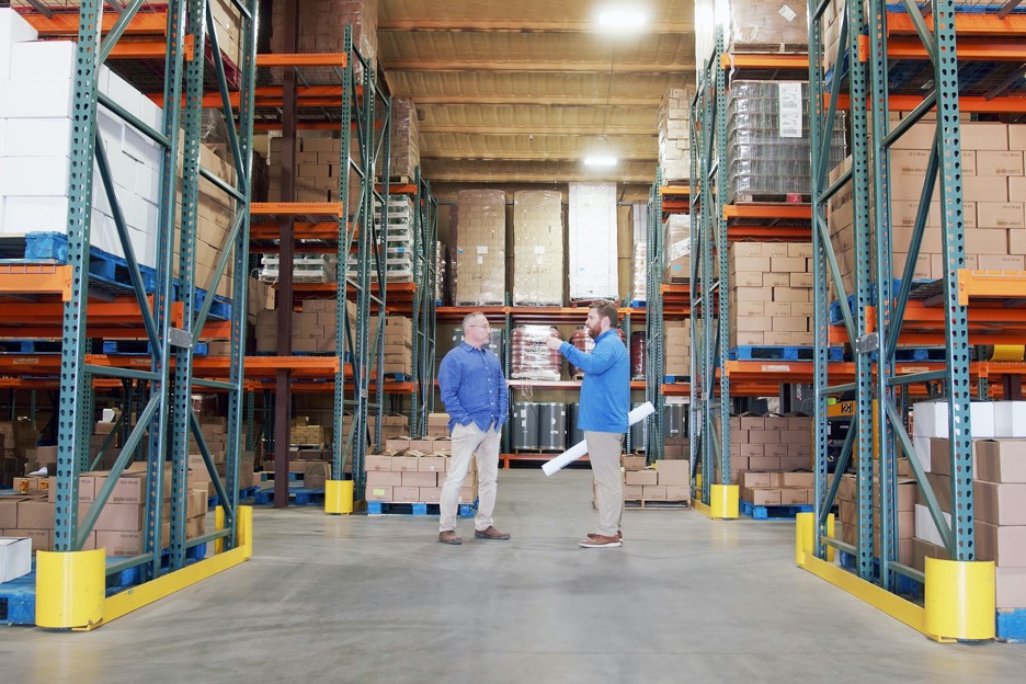 Two men in a warehouse