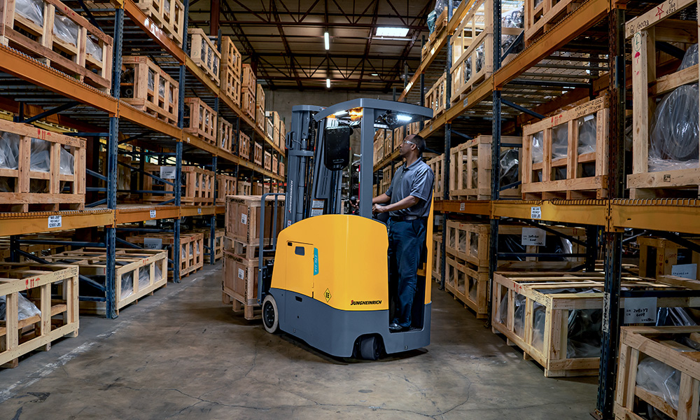 Jungheinrich forklift in warehouse aisle