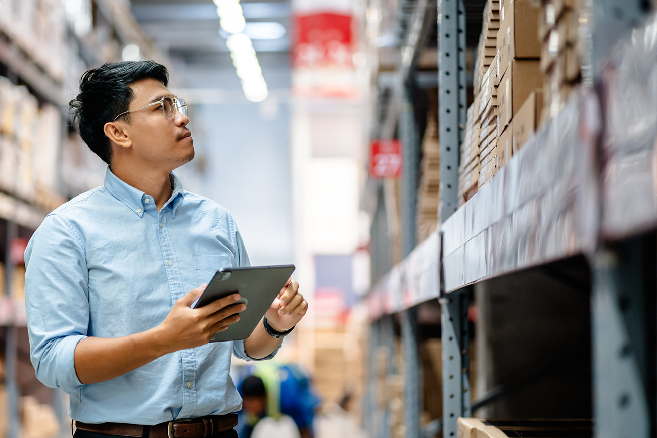 Man in warehouse aisle 